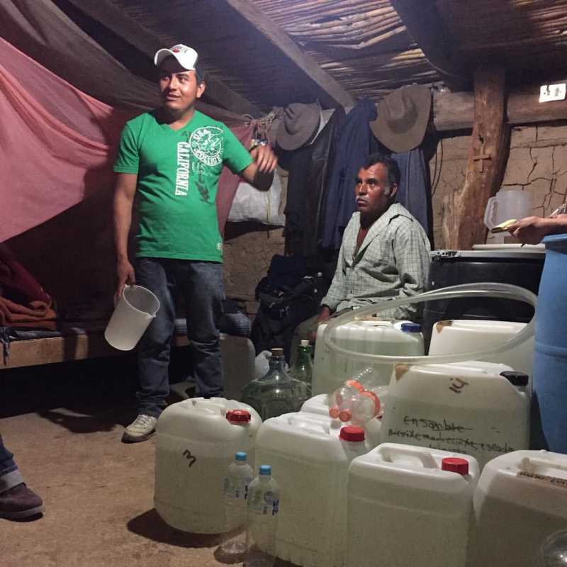 Buying mezcal from Victor Ramos and son. Gallons acquired..jpg